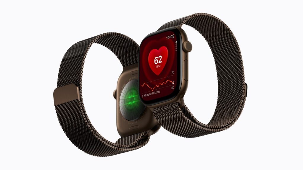 Due Apple Watch Series 12 con Loop in maglia milanese color bronzo scuro, quadrante con frequenza cardiaca